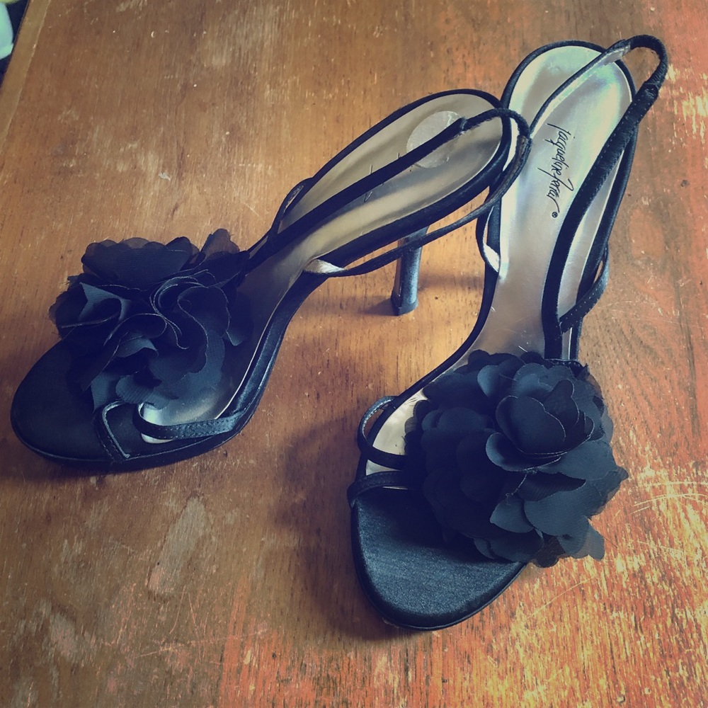 Black sandal heels with flower accent